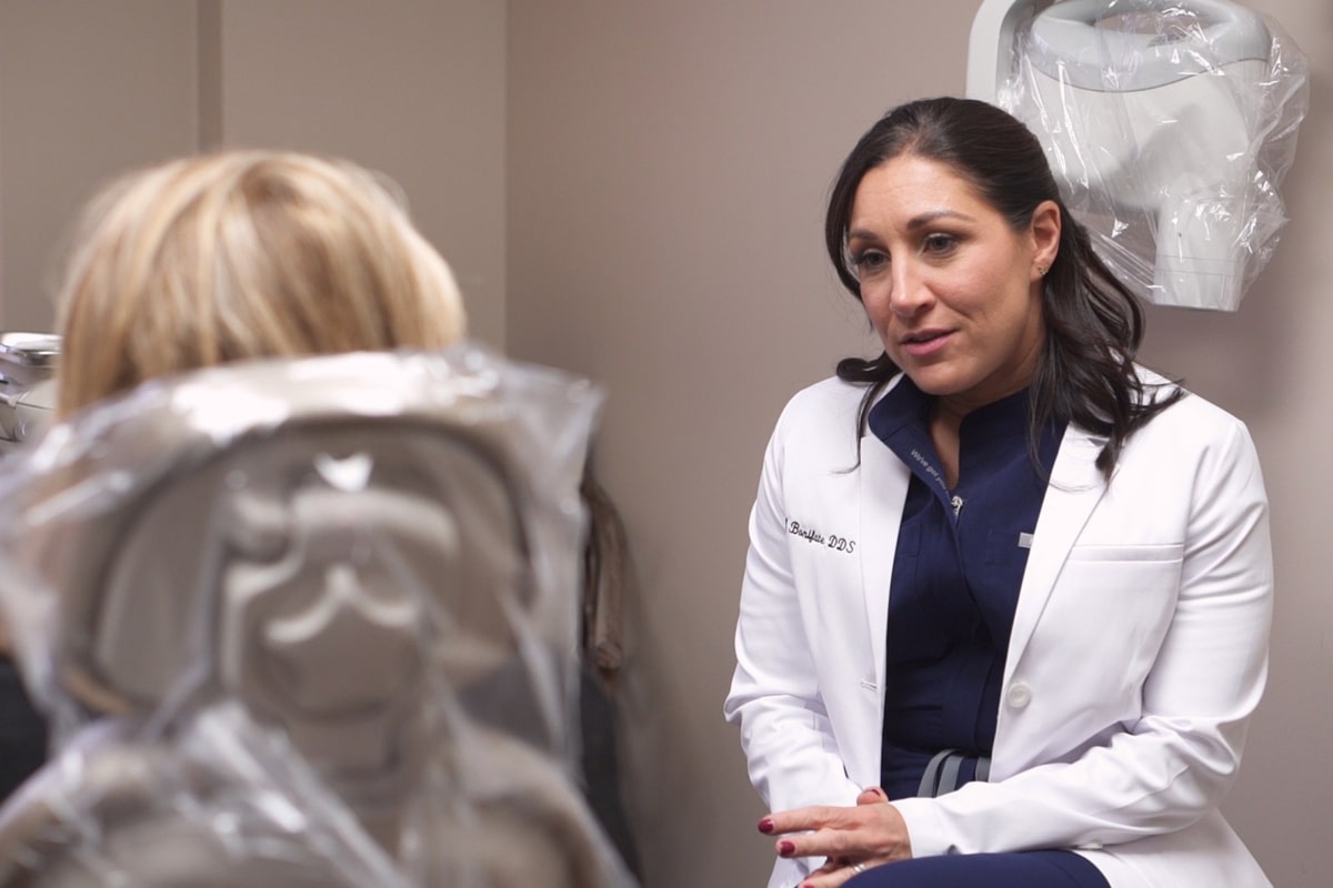 Bronxville dentist Dr. Bonifate discussing dental treatment with a patient
