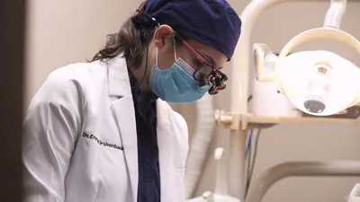 Dr. Kirshenbaum providing dental care of a patient at Bronxville Family Dental