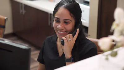 Bronxville Family Dental patient coordinator scheduling an appointment for a patient