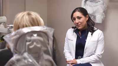 Dr. Bonifate discussing the benefits of facial esthetic injections with a patient