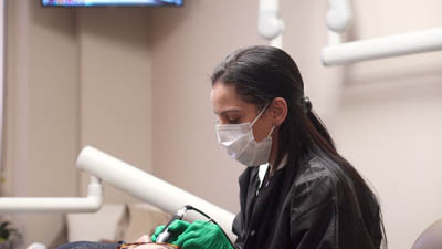 Dr. Goldman providing periodontal care to a patient at Bronxville Family Dental