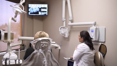 Dr. Bonifate discussing restorative dentistry options with a patient at Bronxville Family Dental